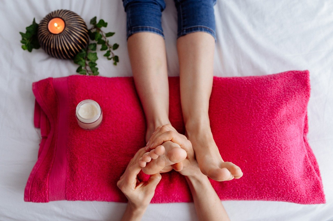 Reflexology treatmen on pink cushion